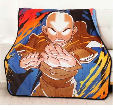 Colorful blanket with an anime character design on a couch in a living room.